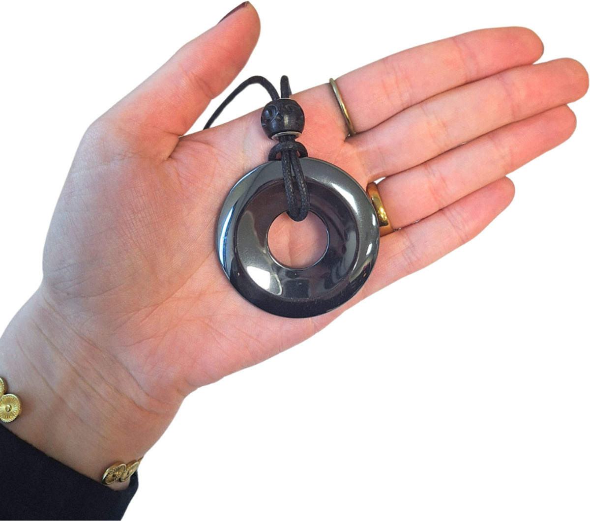 Hematit donut, 50 mm, halsband på vaxsnodd